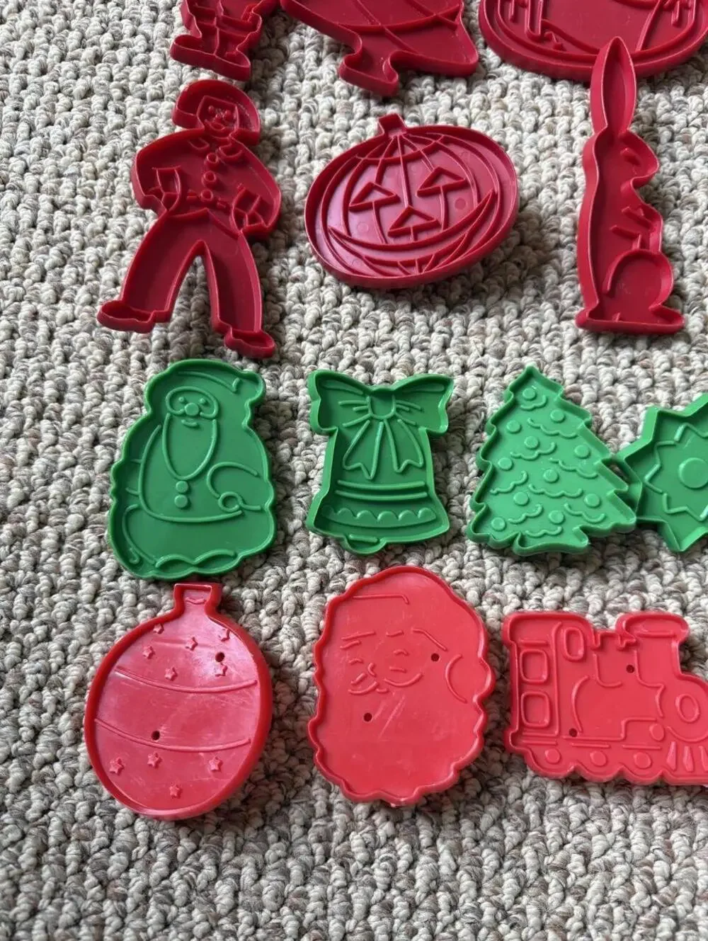 Vintage Christmas cookie cutters with red and green holiday shapes